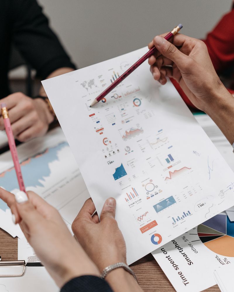 Health economics and outcomes research: analysts reviewing charts and economic data