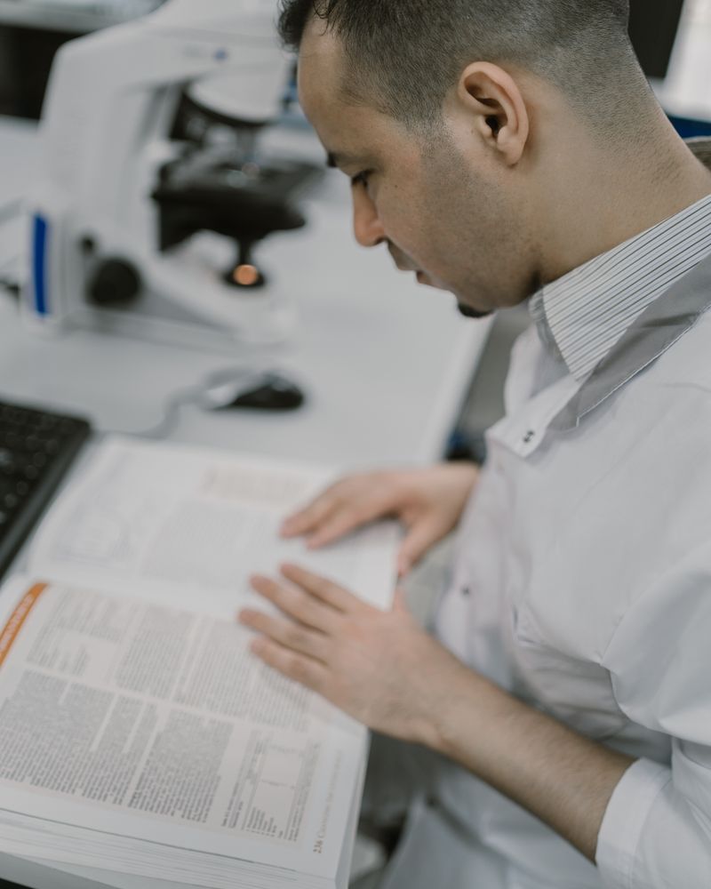 Systematic literature review: medical researcher reading a scientific research paper